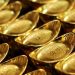Gold surrenders major part of intraday gains; downside seems limited
