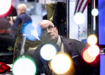 Dollar jumps and global shares fall after Federal Reserve signals slower pace of rate cuts