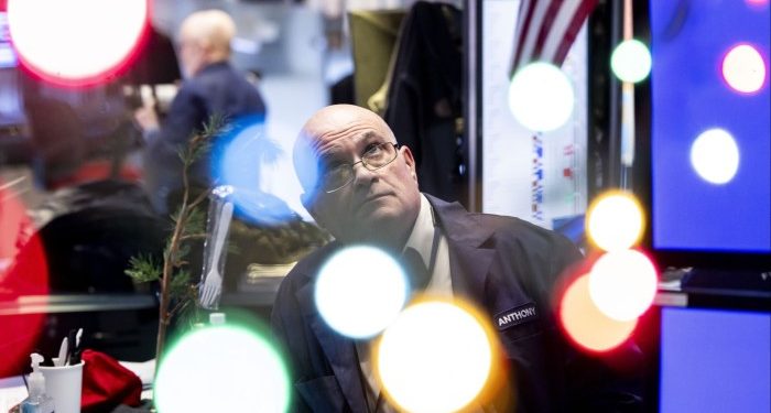 Dollar jumps and global shares fall after Federal Reserve signals slower pace of rate cuts