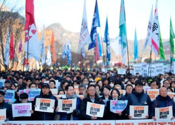 South Korea crisis live: labour unions launch strikes and call for Yoon’s resignation
