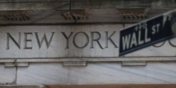 US stocks end slightly lower after day of turbulence on Wall Street