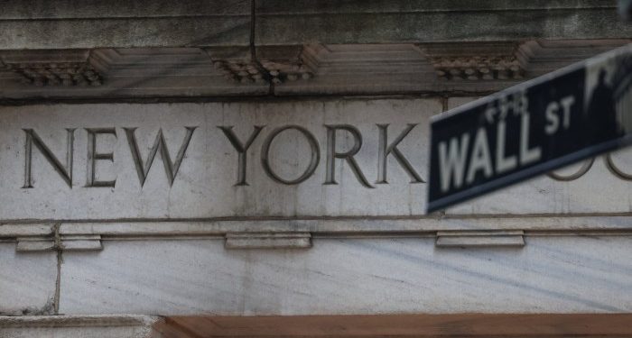 US stocks end slightly lower after day of turbulence on Wall Street