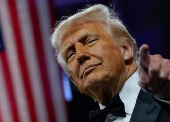 Donald Trump defies market tumult as tariffs take effect