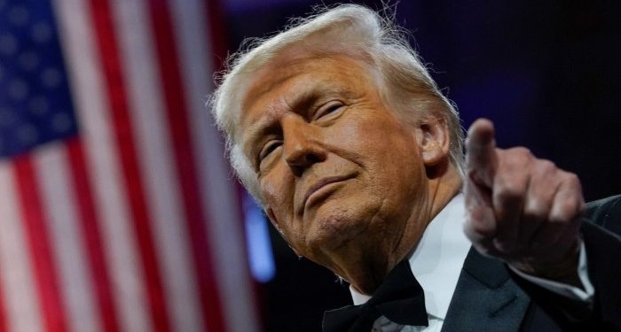 Donald Trump defies market tumult as tariffs take effect