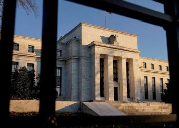 Federal Reserve cuts outlook for US economy but holds interest rates steady