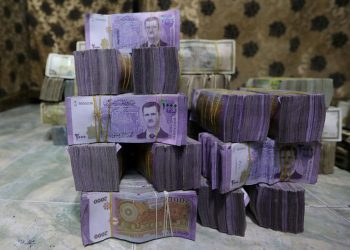 Exclusive-Syria to revalue currency, dropping two zeros in bid for stability
