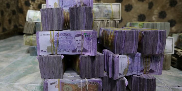 Exclusive-Syria to revalue currency, dropping two zeros in bid for stability