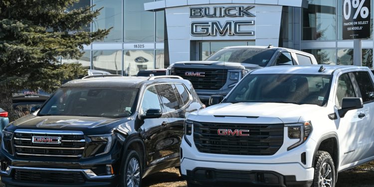 Stocks making the biggest moves premarket: GM, KO, MMM, PM