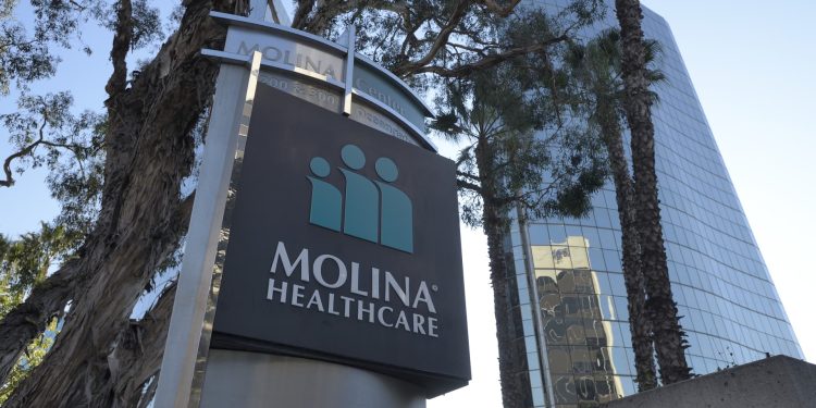 Stocks making the biggest moves midday: MOH, INTC, AXTI, OCFC