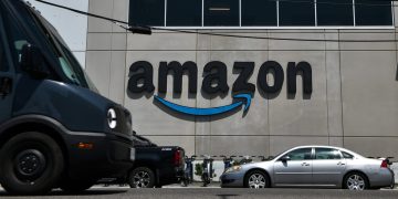 Stocks making the biggest moves midday: AMZN, EL,GOOS, QCOM